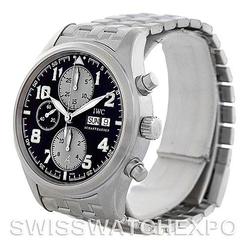 The image shows an IWC Pilot Men
s Stainless Steel Black Dial Men
s Stainless Steel Black Dial model watch from a three-quarter angle, highlighting the face, bezel, crown, pushers, and bracelet.