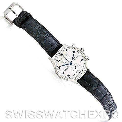 The image shows an IWC Portuguese IW371417 Men
s Stainless Steel Silver Dial IW371417 Men
s Stainless Steel Silver Dial model watch at an oblique angle, displaying the face, strap, and buckle.