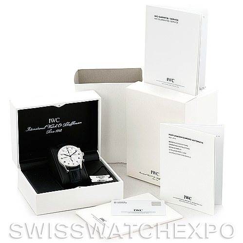 The IWC Portuguese IW371417 Men
s Stainless Steel Silver Dial IW371417 Men
s Stainless Steel Silver Dial model watch is displayed front-facing in its box, surrounded by accompanying accessories and documentation.