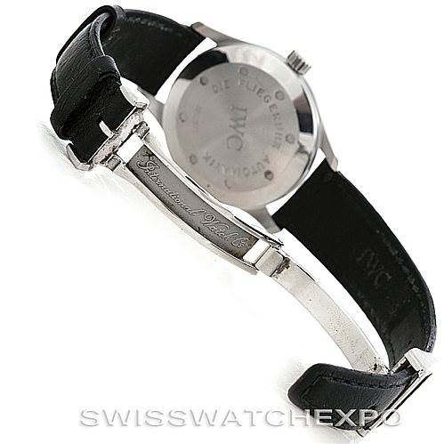 The image shows the back view of an IWC Pilot IW325301 Men's Stainless Steel Black Dial IW325301 Men's Stainless Steel Black Dial model watch, highlighting its leather strap and engraved clasp.