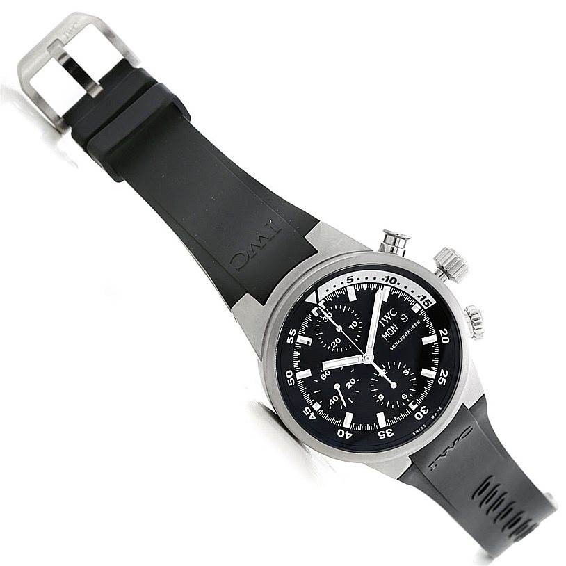 The image shows a tilted angle view of the IWC Aquatimer IW371933 Men's Stainless Steel Black Dial IW371933 Men's Stainless Steel Black Dial watch displaying the face and black rubber strap.