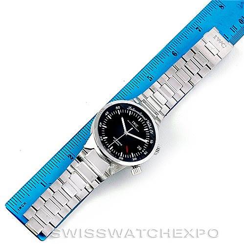 The image shows the IWC GST 3537 Men's Stainless Steel Black Dial 3537 Men's Stainless Steel Black Dial model watch laid flat with its face and bracelet fully visible, alongside a blue ruler for scale.