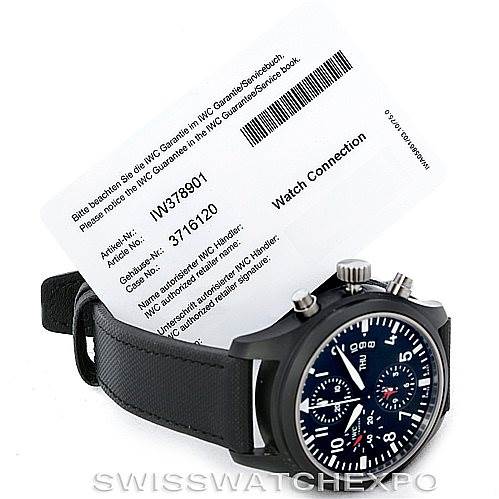 The image shows an angled view of the IWC Pilot IW378901 Men's Titanium Black Dial IW378901 Men's Titanium Black Dial model watch with a visible dial, strap, and accompanying service card.