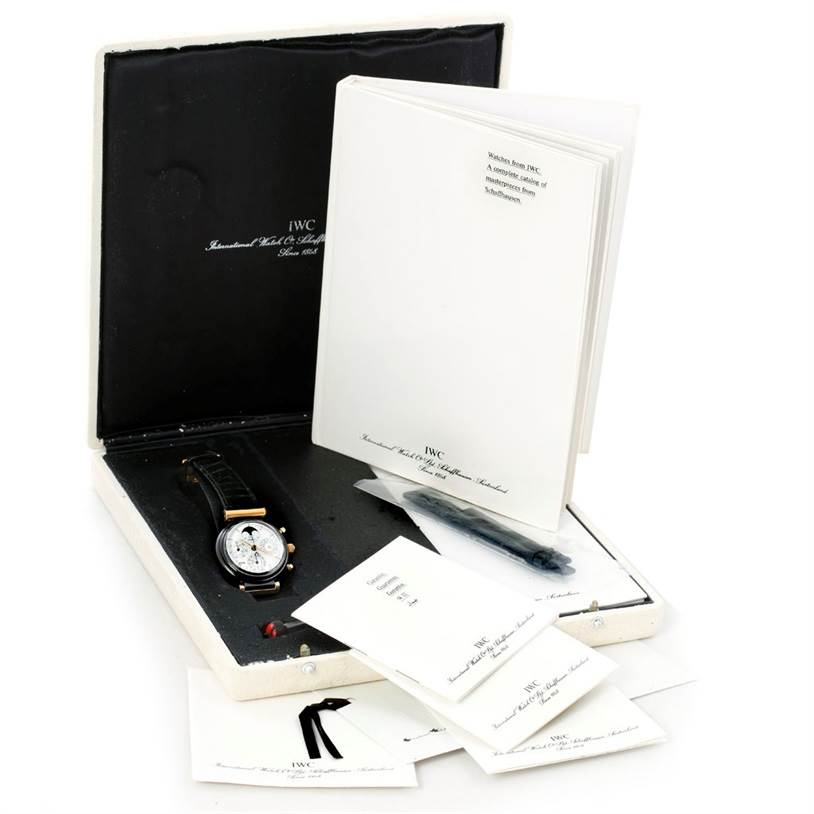 The IWC Da Vinci 3755 Men's Yellow Gold White Dial 3755 Men's Yellow Gold White Dial watch is displayed in its open box with accompanying booklets and accessories.