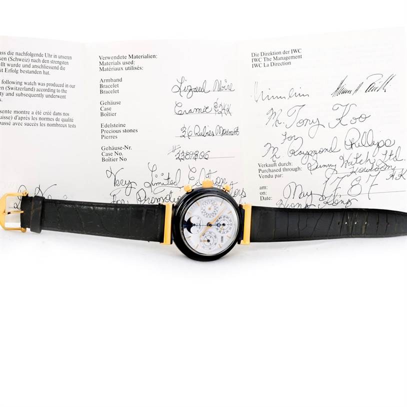 The IWC Da Vinci 3755 Men's Yellow Gold White Dial 3755 Men's Yellow Gold White Dial watch is displayed face-up alongside its certification and documentation.