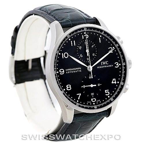 The image displays an angled view of the IWC Portuguese IW371447 Men
s Stainless Steel Black Dial IW371447 Men
s Stainless Steel Black Dial model watch, showing its black dial, silver casing, chronograph sub-dials, and leather strap.