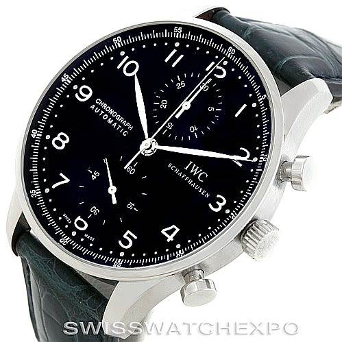 This image shows the IWC Portuguese IW371447 Men
s Stainless Steel Black Dial IW371447 Men
s Stainless Steel Black Dial model watch at an oblique angle, displaying its face, crown, and chronograph pushers.
