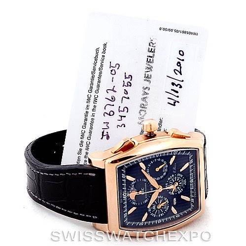 The IWC Da Vinci IW376205 Men's Rose Gold Black Dial IW376205 Men's Rose Gold Black Dial watch is shown at a slight angle, displaying its face, side, and part of the black leather strap.