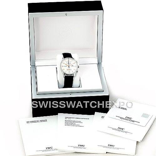 The image shows the IWC Portuguese IW371401 Men
s Stainless Steel Silver Dial IW371401 Men
s Stainless Steel Silver Dial model watch in its display box, accompanied by several booklets and documents.