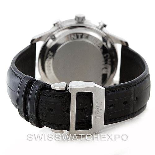 The image shows the back of the IWC Portuguese IW371401 Men
s Stainless Steel Silver Dial IW371401 Men
s Stainless Steel Silver Dial watch and its clasp on a black leather strap.