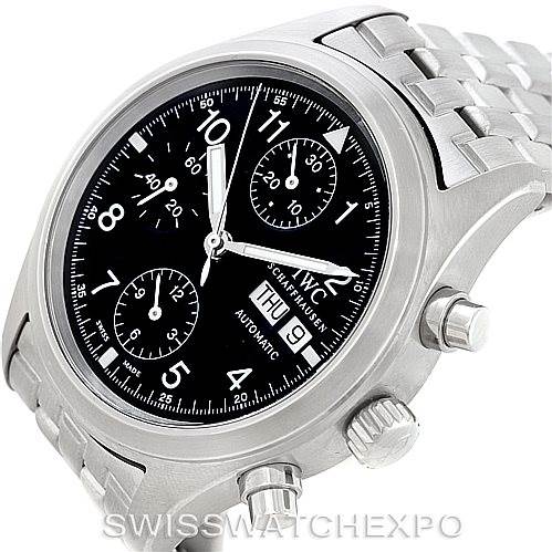 The image shows an angled view of the IWC Pilot IW370607 Men's Stainless Steel Black Dial IW370607 Men's Stainless Steel Black Dial model watch, displaying the face, chronograph dials, and part of the metal bracelet.