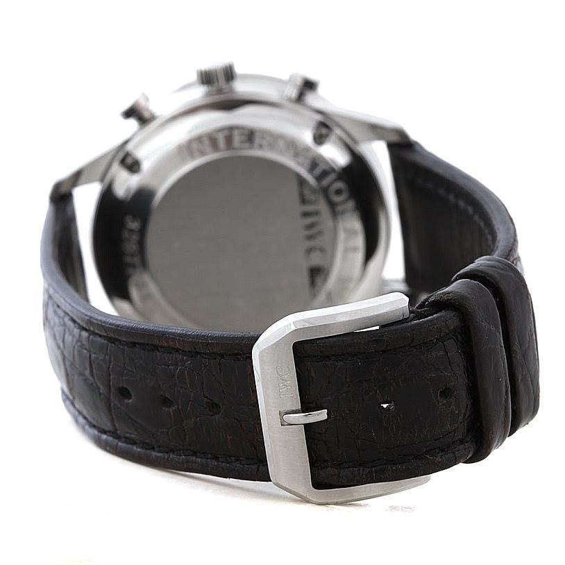 The image shows the backside of an IWC Portuguese IW371438 Men
s Stainless Steel Black Dial IW371438 Men
s Stainless Steel Black Dial model watch, including the case back, pushers, and leather strap with a buckle.