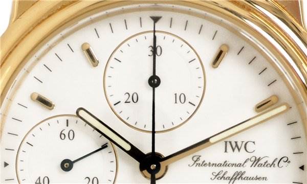 This close-up shows the dial and subdials of a Vintage IWC watch, highlighting the brand logo and some markers.