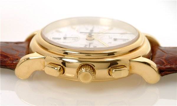 The IWC Vintage 3703 Men's Yellow Gold White Dial 3703 Men's Yellow Gold White Dial model watch is shown from a side angle, displaying the crown, pushers, and part of the leather strap.