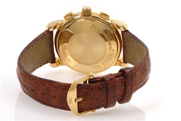 The image shows the back case, buckle, and brown leather strap of a Vintage IWC watch.