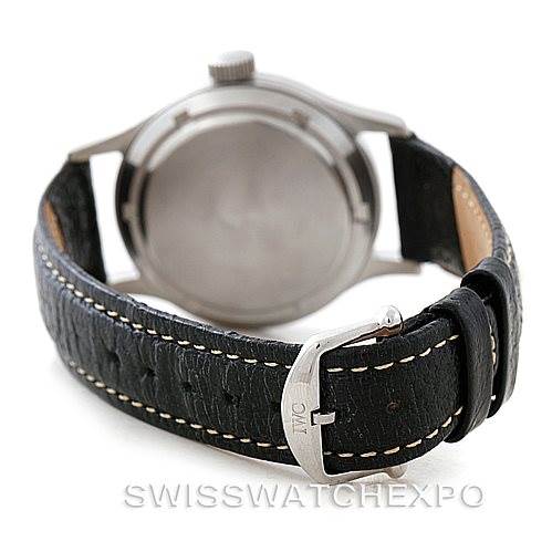 The image shows the rear side of an IWC Pilot MARK XI Men
s Stainless Steel Black Dial MARK XI Men
s Stainless Steel Black Dial watch, focusing on the case back and leather strap with the IWC buckle.