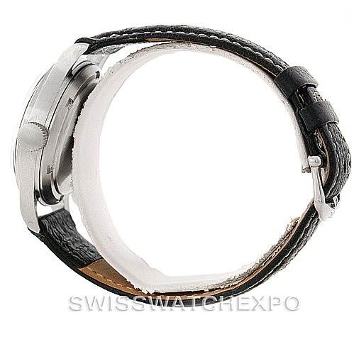 This image shows the IWC Pilot MARK XI Men
s Stainless Steel Black Dial MARK XI Men
s Stainless Steel Black Dial model watch from a side view, highlighting the case, bezel, crown, and leather strap with a buckle.