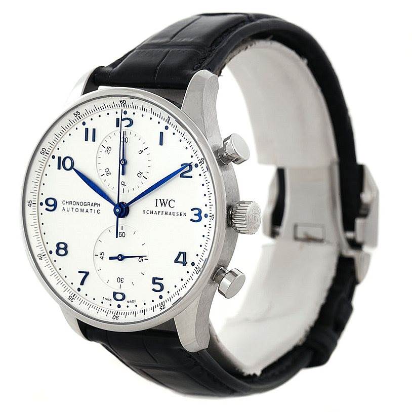 This image shows a side-angle view of the IWC Portuguese IW371446 Men
s Stainless Steel Silver Dial IW371446 Men
s Stainless Steel Silver Dial Chronograph Automatic watch, highlighting its white dial, blue hands, and black leather strap.