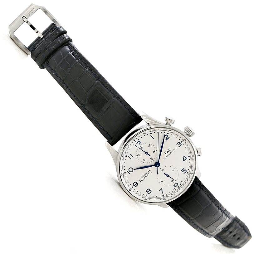 The image shows an IWC Portuguese IW371417 Men's Stainless Steel Silver Dial IW371417 Men's Stainless Steel Silver Dial model watch at a slightly tilted angle, displaying the face, strap, and buckle.