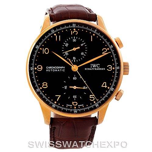 The image shows a front view of the IWC Portuguese IW371415 Men's Rose Gold Black Dial IW371415 Men's Rose Gold Black Dial Chronograph watch, featuring a black dial, gold case, and brown leather strap.