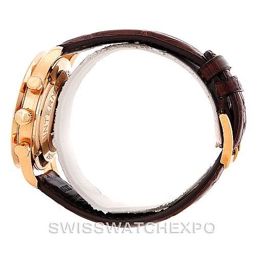 The image shows a side view of an IWC Portuguese IW371415 Men's Rose Gold Black Dial IW371415 Men's Rose Gold Black Dial watch, showcasing the crown, pushers, and part of the leather strap.