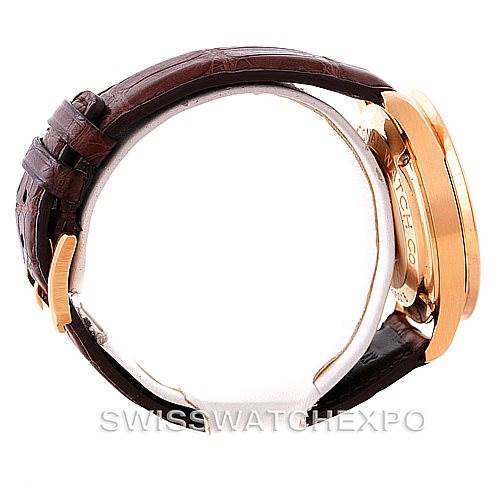 Side view of the IWC Portuguese IW371415 Men's Rose Gold Black Dial IW371415 Men's Rose Gold Black Dial watch highlighting its gold case and brown leather strap.