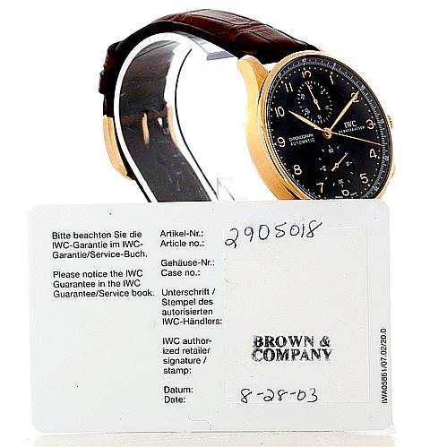 The image shows a side and frontal view of an IWC Portuguese IW371415 Men's Rose Gold Black Dial IW371415 Men's Rose Gold Black Dial model watch with an accompanying warranty card.
