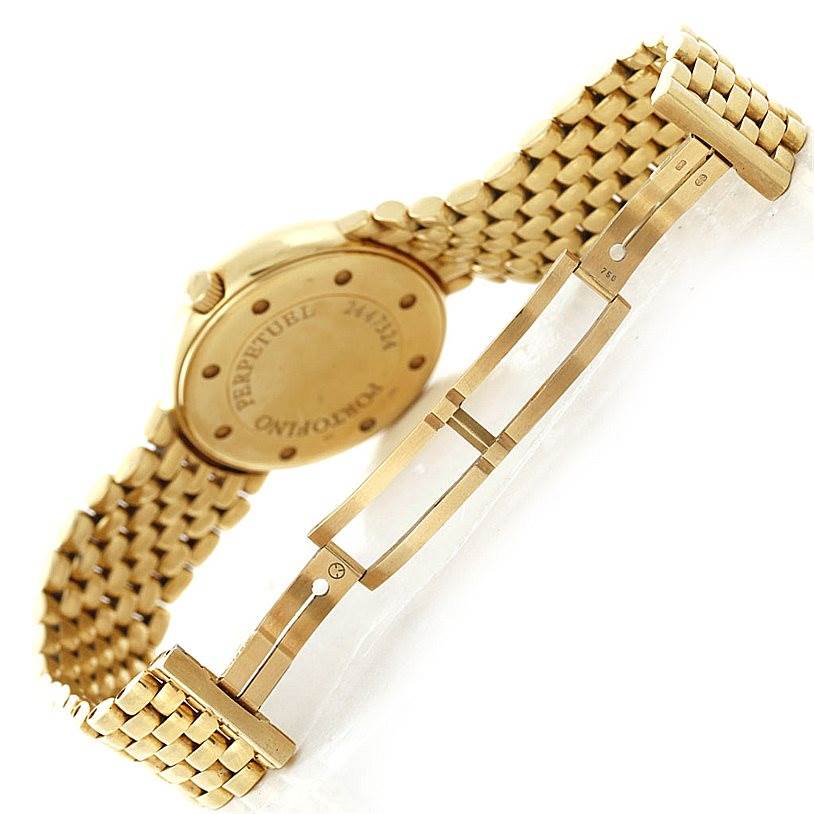 The image shows the gold bracelet and case back of an IWC Portofino 3541 Men's Yellow Gold White Dial 3541 Men's Yellow Gold White Dial watch with a partially open clasp.