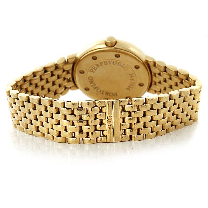 The image shows the back view of an IWC Portofino 3541 Men's Yellow Gold White Dial 3541 Men's Yellow Gold White Dial watch, highlighting its gold bracelet and caseback.