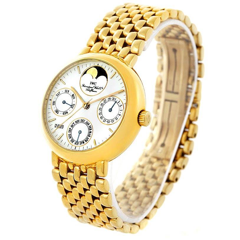 The image shows a side angle view of an IWC Portofino 3541 Men's Yellow Gold White Dial 3541 Men's Yellow Gold White Dial watch, highlighting its dial, bezel, bracelet, and crown.
