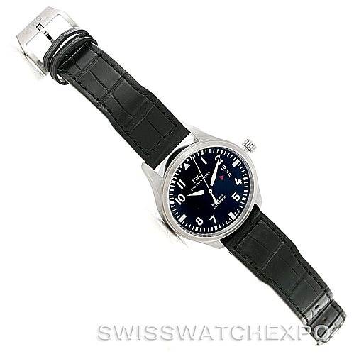 The image shows an overhead view of an IWC Pilot IW326501 Men's Stainless Steel Black Dial IW326501 Men's Stainless Steel Black Dial model watch, highlighting the leather strap, dial, and clasp.