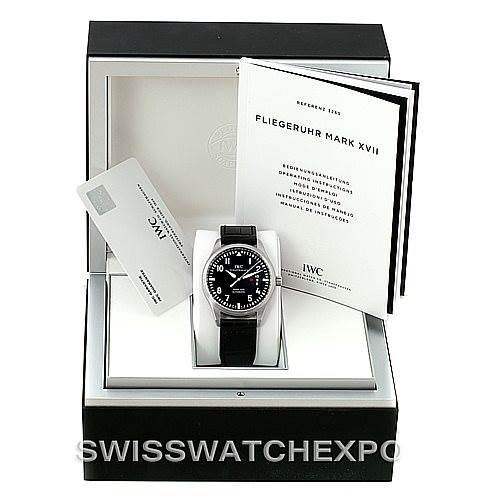 The image shows an IWC Pilot IW326501 Men's Stainless Steel Black Dial IW326501 Men's Stainless Steel Black Dial model watch in its box with manuals and a card from a straight-on angle.