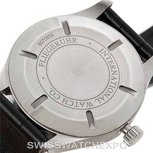 The image shows the back case of an IWC Pilot IW326501 Men's Stainless Steel Black Dial IW326501 Men's Stainless Steel Black Dial watch, displaying its stainless steel finish and engraved branding.