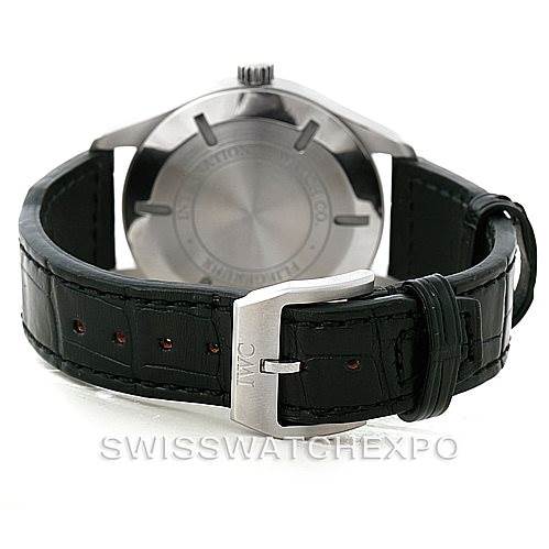 The image shows the back of an IWC Pilot IW326501 Men's Stainless Steel Black Dial IW326501 Men's Stainless Steel Black Dial model watch, featuring the case back, crown, leather strap, and buckle.