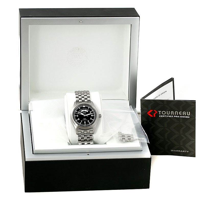 The IWC Pilot IW325102 Men's Stainless Steel Black Dial IW325102 Men's Stainless Steel Black Dial model watch is shown in its open box, along with a booklet and extra metal links.