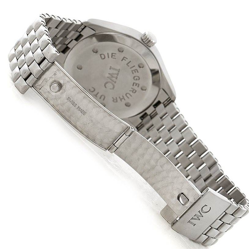 The image shows the back and bracelet of a Pilot model watch by IWC, with the clasp and "Swiss Made" visible.