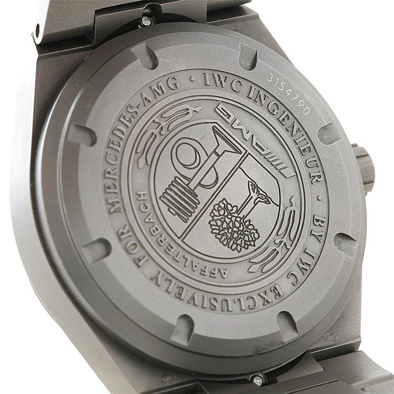 This image shows the case back of the IWC Ingenieur IW322703 Men's Titanium Black Dial IW322703 Men's Titanium Black Dial watch, featuring engraved details and branding.