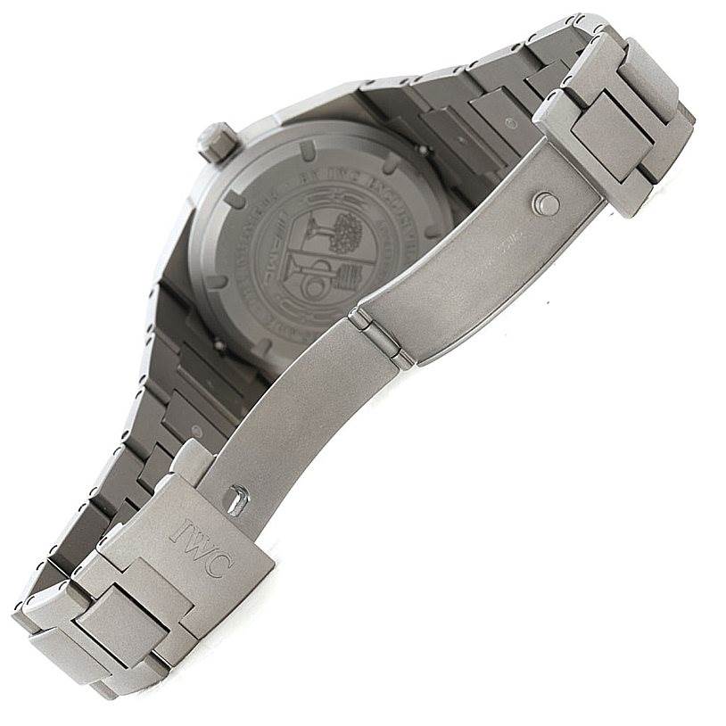 The image shows the back of an IWC Ingenieur IW322703 Men's Titanium Black Dial IW322703 Men's Titanium Black Dial watch with its bracelet and clasp in view.