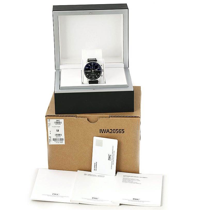 The IWC Portuguese IW371438 Men's Stainless Steel Black Dial IW371438 Men's Stainless Steel Black Dial watch is shown front-on in its display box, along with its outer packaging and accompanying documents.