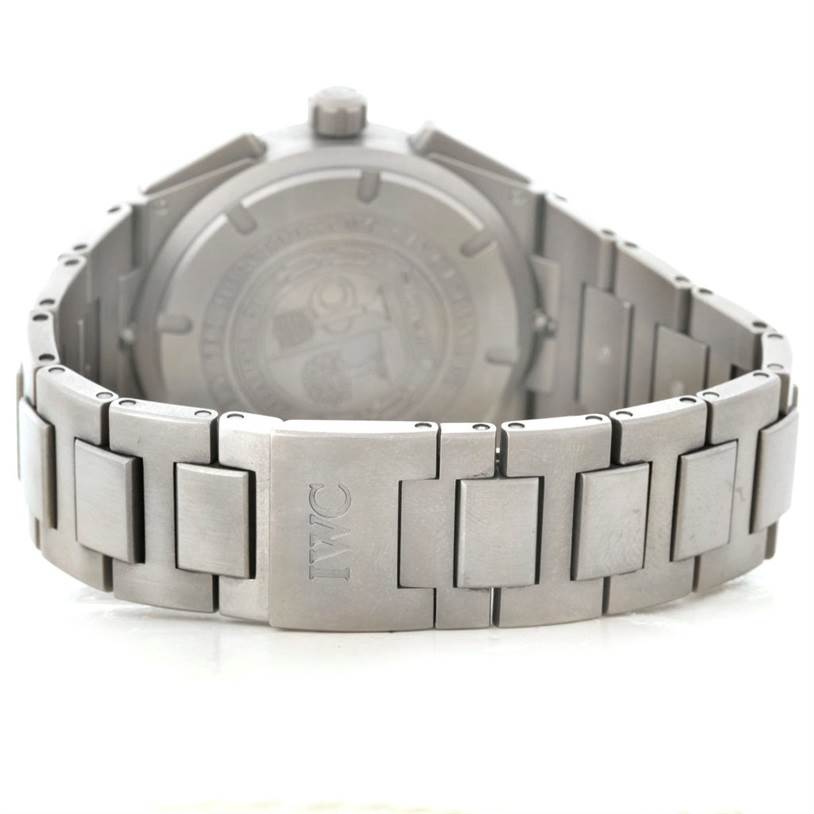 The image shows the back and strap of an IWC Ingenieur IW372503 Men's Titanium Black Dial IW372503 Men's Titanium Black Dial watch, highlighting its metal bracelet and clasp with the IWC logo.