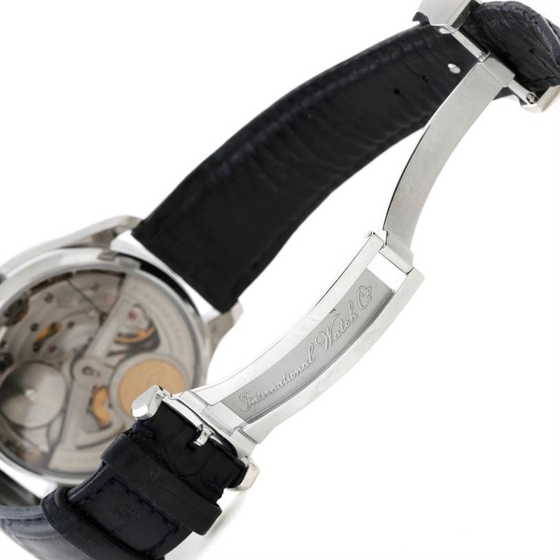 The image shows the back view of an IWC Portuguese IW500107 Men's Stainless Steel Silver Dial IW500107 Men's Stainless Steel Silver Dial model watch, highlighting its inner mechanism and clasp with the brand engraving.