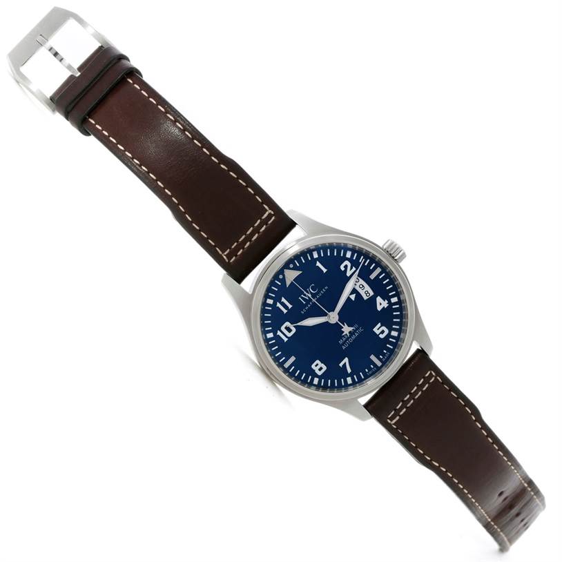The IWC Pilot IW326506 Men's Stainless Steel Blue Dial IW326506 Men's Stainless Steel Blue Dial model watch is displayed from an elevated angle, showing the face, crown, case, and the entire leather strap.