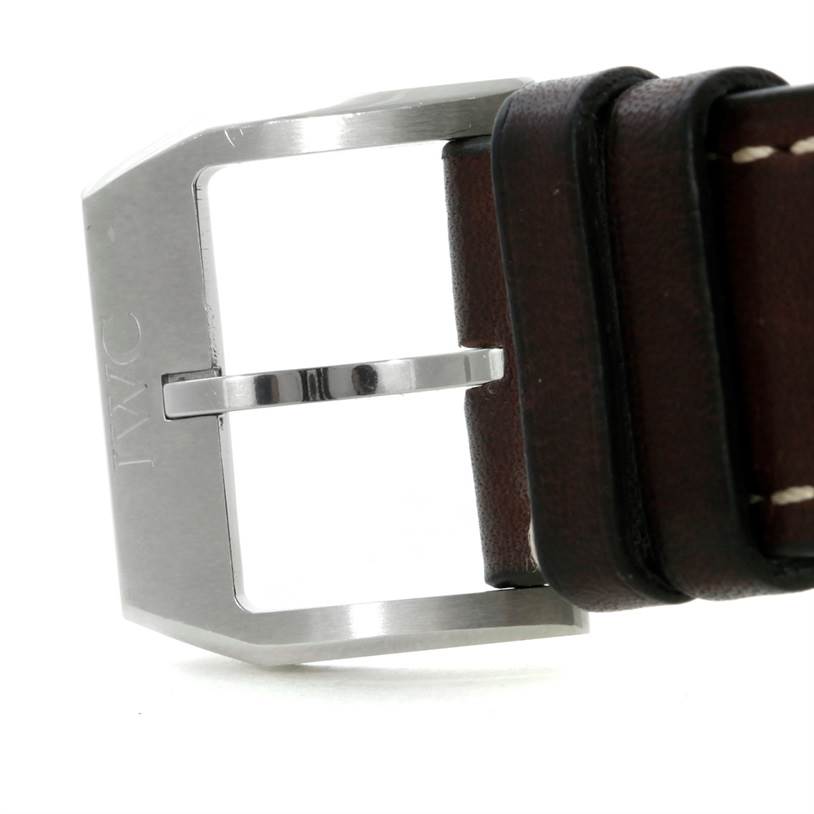 The image shows a close-up of the buckle and part of the leather strap of the IWC Pilot IW326506 Men's Stainless Steel Blue Dial IW326506 Men's Stainless Steel Blue Dial model watch.