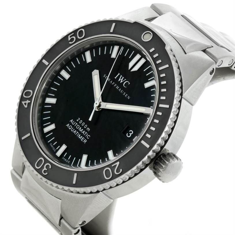 This GST model by IWC is shown at an angled side view, highlighting the dial, bezel, crown, and part of the bracelet.