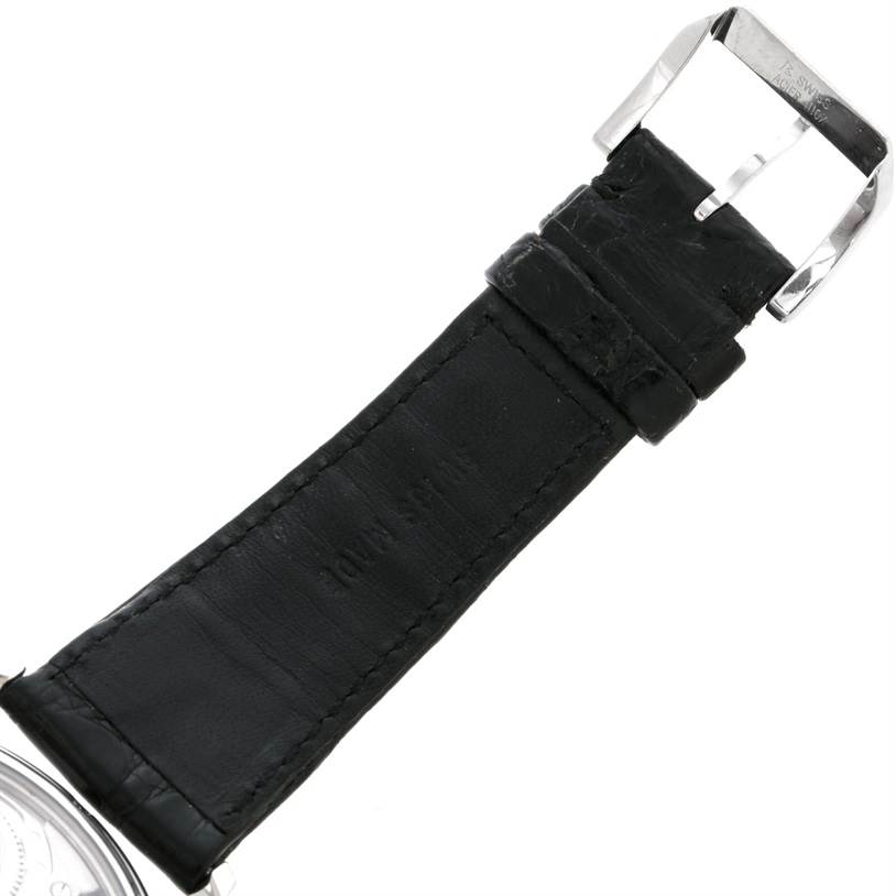 This image shows the leather strap and buckle of an IWC Portuguese IW545405 Men's Stainless Steel Silver Dial IW545405 Men's Stainless Steel Silver Dial model watch from an angled overhead view.