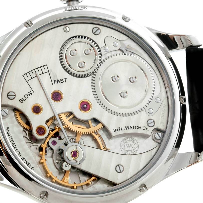 The image shows a close-up of the IWC Portuguese IW545405 Men's Stainless Steel Silver Dial IW545405 Men's Stainless Steel Silver Dial model watch's mechanical movement from the back.