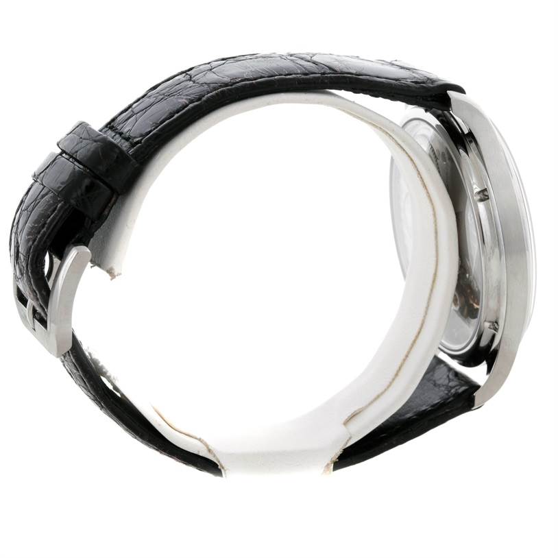 The image shows a side view of an IWC Portuguese IW545405 Men's Stainless Steel Silver Dial IW545405 Men's Stainless Steel Silver Dial watch, displaying its black leather strap and stainless steel case.