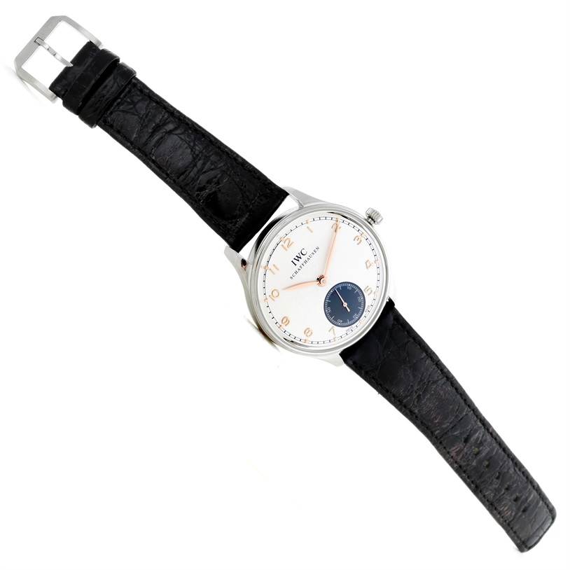 The IWC Portuguese IW545405 Men's Stainless Steel Silver Dial IW545405 Men's Stainless Steel Silver Dial model watch is displayed at a slight angle, showing its face, crown, and black leather strap.