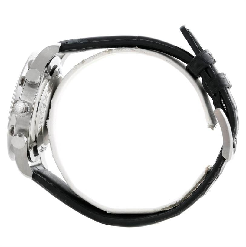 The image shows the side view of a Portuguese model watch by IWC, highlighting its case, crown, buttons, and leather strap.