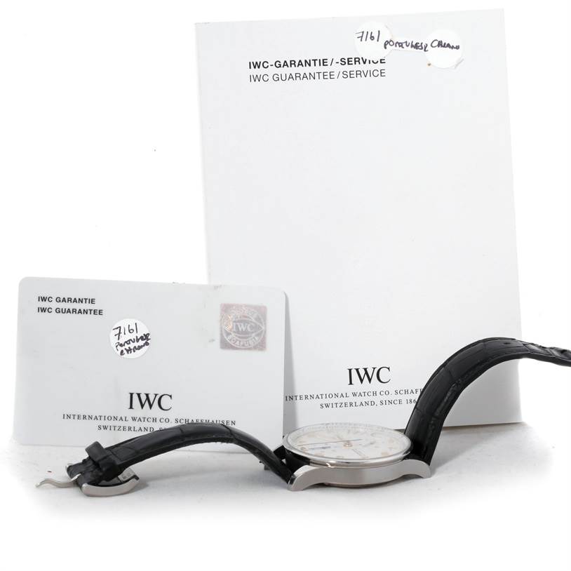 The image shows a side view of an IWC Portuguese IW371445 Men's Stainless Steel Silver Dial IW371445 Men's Stainless Steel Silver Dial watch, with accompanying guarantee card and booklet.